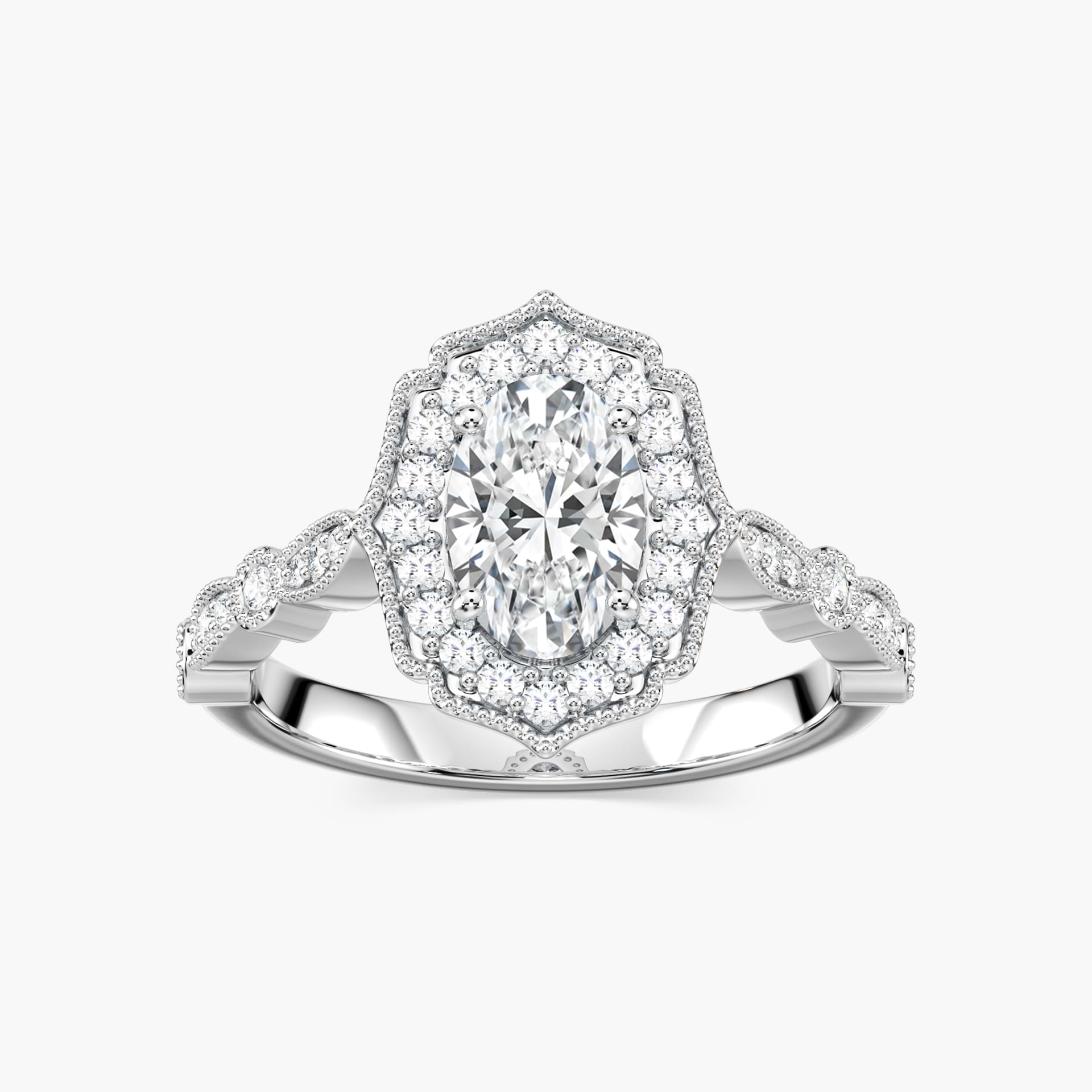 Shown with 1ct Oval Cut Lab Grown Diamond in 14k Yellow Gold|Romantic vintage style diamond accented halo engagement ring with a 1ct oval cut lab grown diamond set in filigree and milgrain detailed 14k yellow gold band