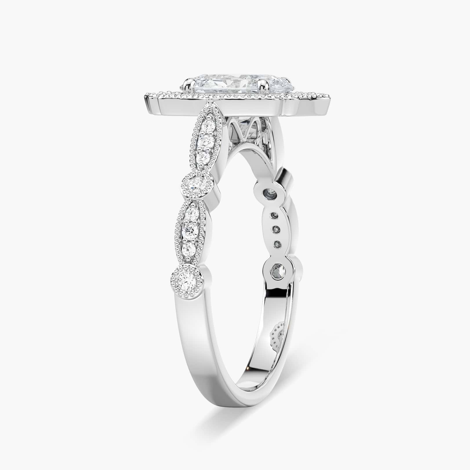 Shown with 1ct Oval Cut Lab Grown Diamond in 14k Yellow Gold|Romantic vintage style diamond accented halo engagement ring with a 1ct oval cut lab grown diamond set in filigree and milgrain detailed 14k yellow gold band
