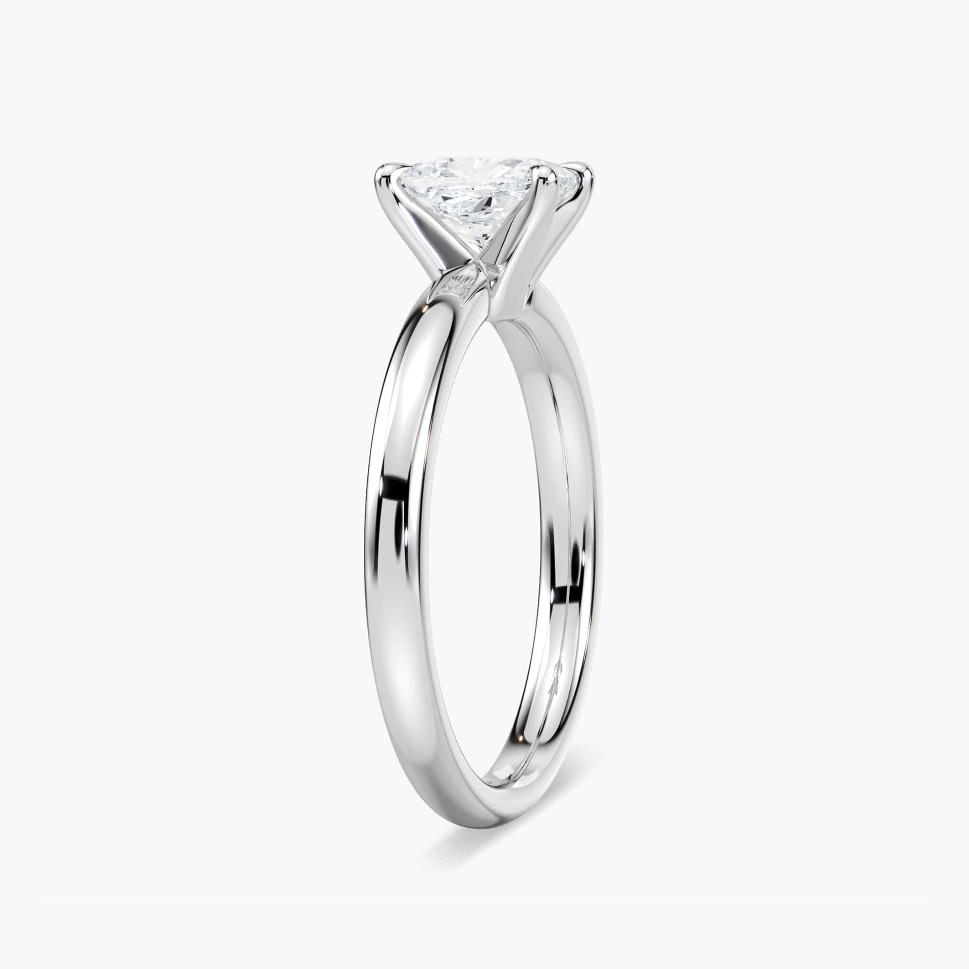 Shown in 14K Yellow Gold with a 2ct Emerald Cut Lab Grown Diamond center stone|traditional solitaire claw prong engagement ring in 14k recycled yellow gold metal with emerald cut lab grown diamond by MiaDonna