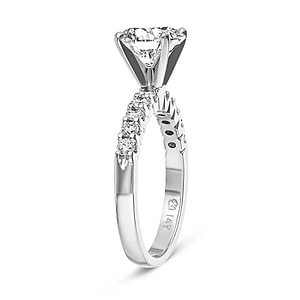 diamond accented ring with a round cut lab grown diamond center stone