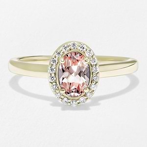 halo engagement ring featuring a lab grown gemstone pink champagne sapphire center stone in yellow gold