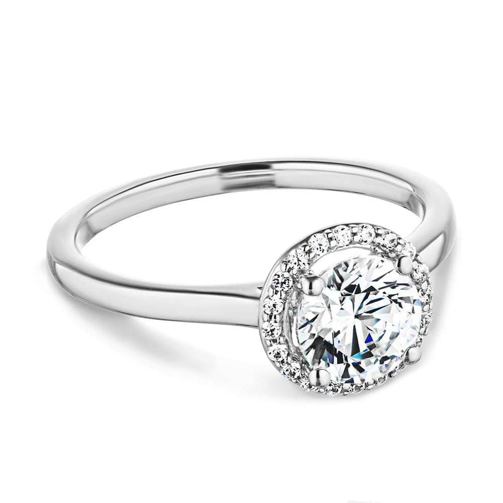Shown with 1ct Round Cut Lab Grown Diamond in 14k White Gold|Beautiful stackable engagement ring with a diamond halo surrounding a 1ct round cut lab grown diamond in 14k white gold