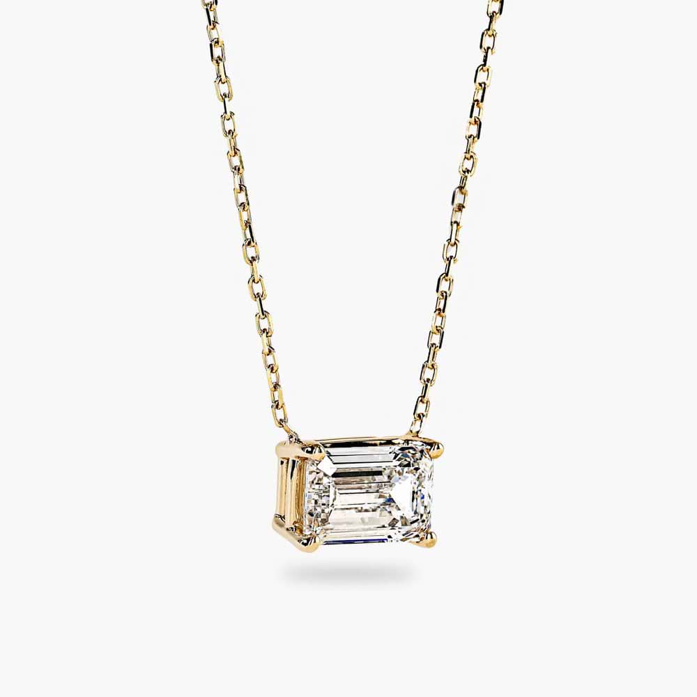 Shown in 14K Yellow Gold|basket pendant featuring an emerald cut lab grown diamond set in recycled yellow gold by MiaDonna