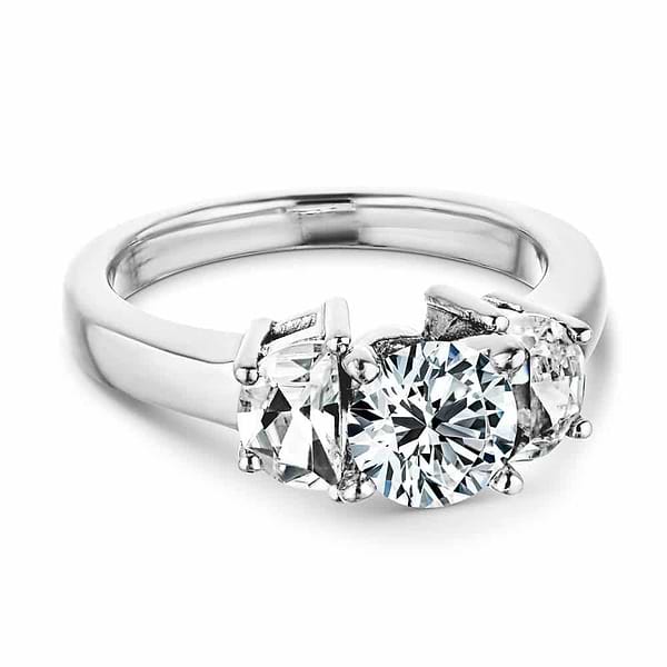 Shown with 1ct Round Cut Lab Grown Diamonds in 14k White Gold|Beautiful three stone engagement ring with 1ct round cut lab grown diamond with half moon cut diamond side stones in 14k white gold