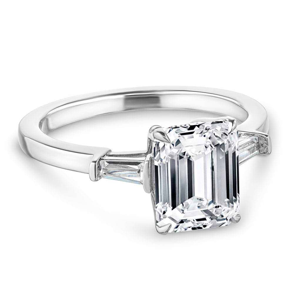 Shown with 1ct Emerald Cut Lab Grown Diamond in 14k White Gold|Baguette side stone engagement ring with 1ct emerald cut lab grown diamond in 14k white gold with peek-a-boo diamonds