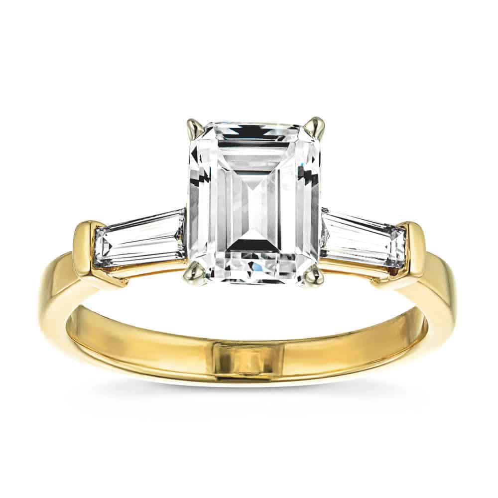 Shown In 14K Yellow Gold With An Emerald Cut Center Stone|three stone baguette ring with an emerald cut lab grown diamond center stone