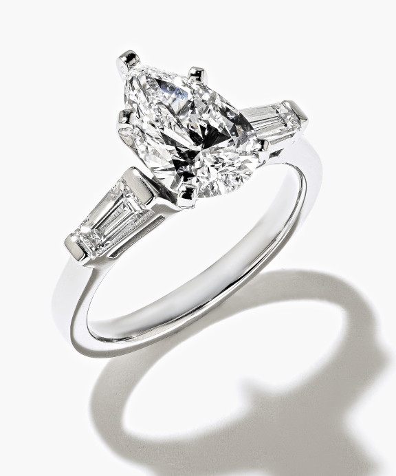Three Stone Diamond Ring, set with a Pear Cut Diamond and baguette-cut side lab-grown diamonds.