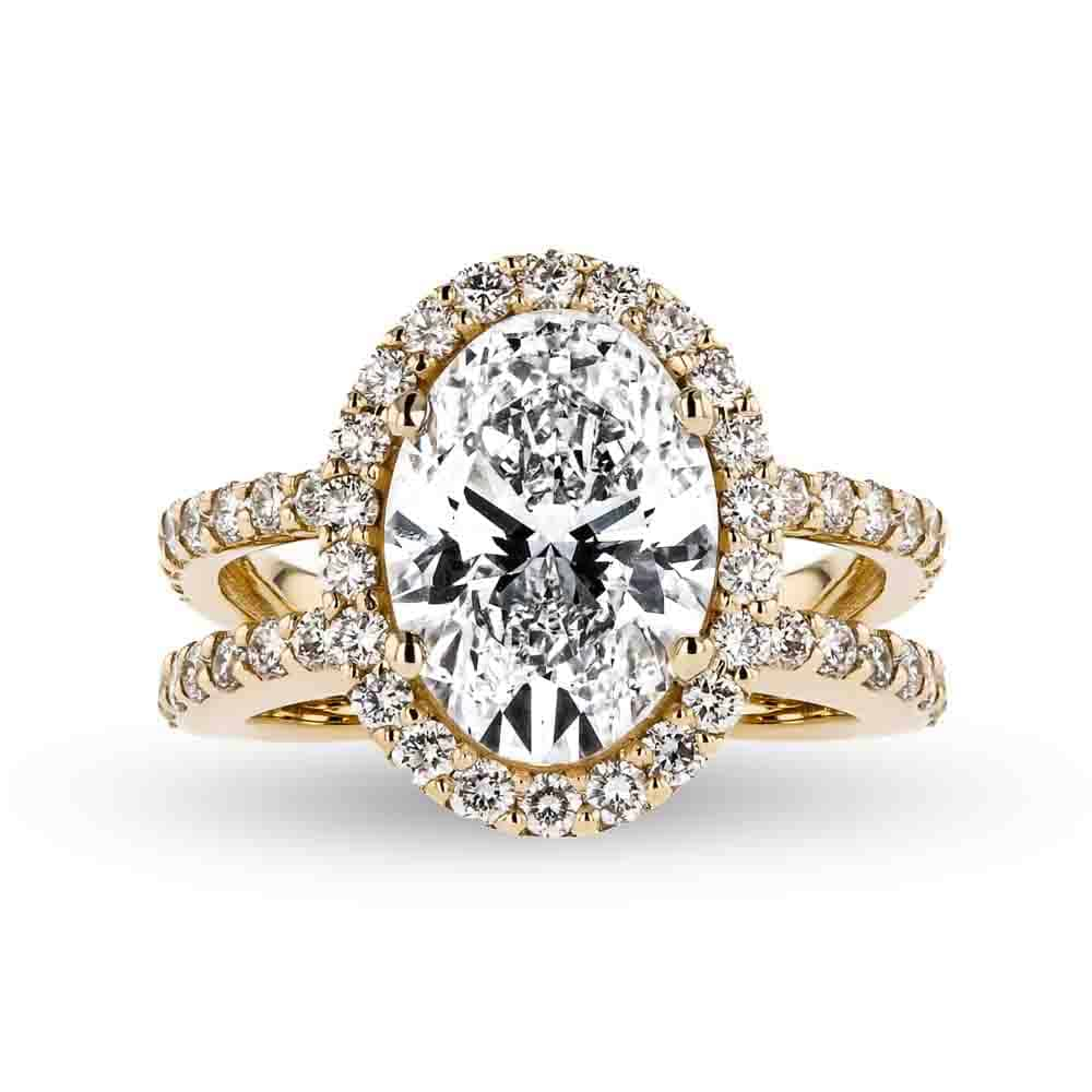 Shown with 2.89ct Oval Cut Lab Grown Diamond set in 18k Yellow Gold|Celebrity inspired diamond accented halo engagement ring with 2.89ct oval cut lab grown diamond center stone set in 18k yellow gold