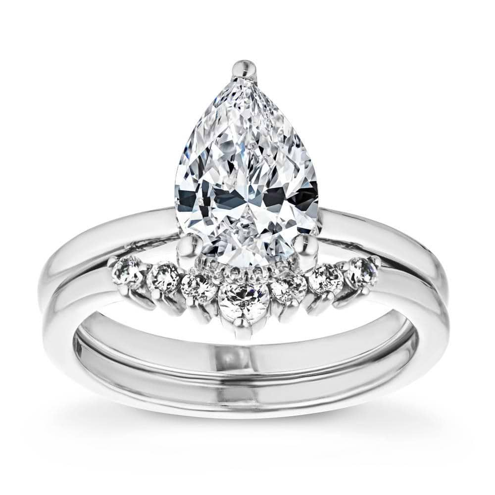 Shown with a 1.0ct Pear cut Lab-Grown Diamond with a hidden halo in recycled 14K white gold with matching wedding band | wedding set hidden halo diamond accented recycled 14k white gold 1.0ct pear cut lab-grown diamond