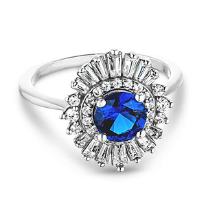 Unique stunning vintage style diamond halo engagement ring with baguette cut diamonds surrounding a 1ct round cut lab grown blue sapphire in 14k white gold