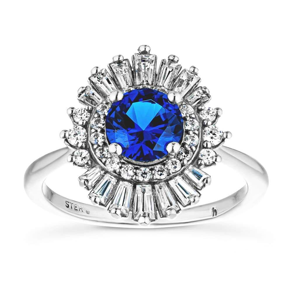 Shown with 1ct Round Cut Lab Grown Blue Sapphire|Unique stunning vintage style diamond halo engagement ring with baguette cut diamonds surrounding a 1ct round cut lab grown blue sapphire in 14k white gold