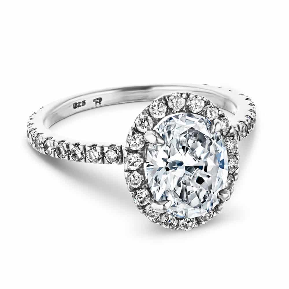 Shown with 1ct Oval Cut Lab Grown Diamond in Platinum|Dream diamond halo engagement ring with diamond accents and a 1ct oval cut lab grown diamond in platinum