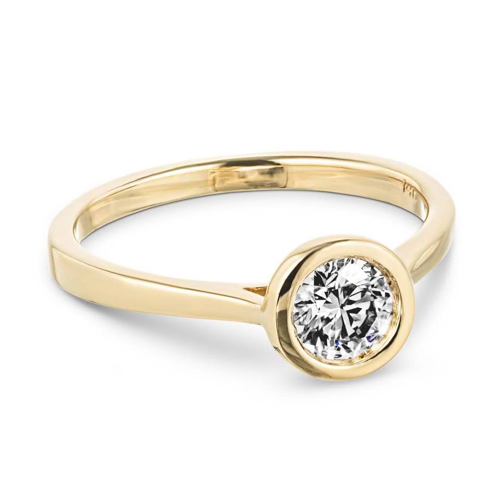 Shown with 1ct Round Cut Lab Grown Diamond in 14k Yellow Gold|Modern minimalistic engagement ring with 1ct round cut bezel set lab grown diamond in 14k yellow gold