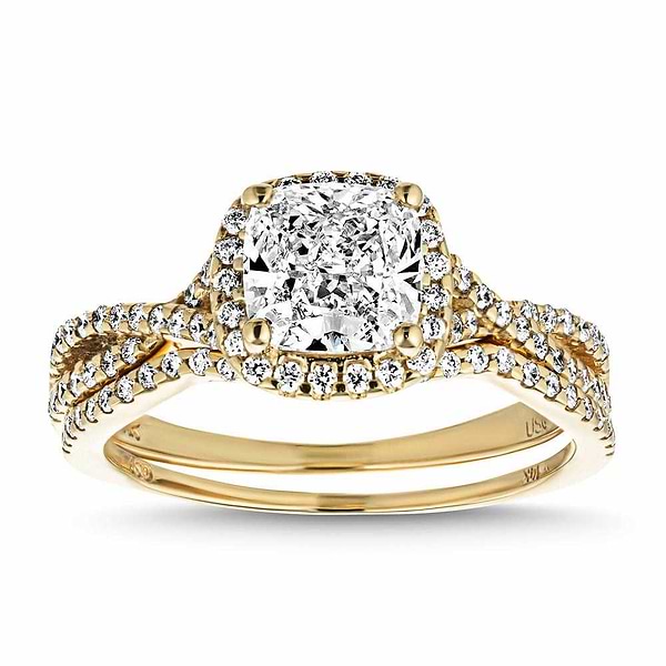 Eternal Monogram Wedding Set shown in recycled 14K yellow gold featuring a cushion cut center stone surrounded by a halo of recycled diamonds continuing down the shank with matching wedding band | eternal monogram wedding set recycled diamonds engagement ring wedding band