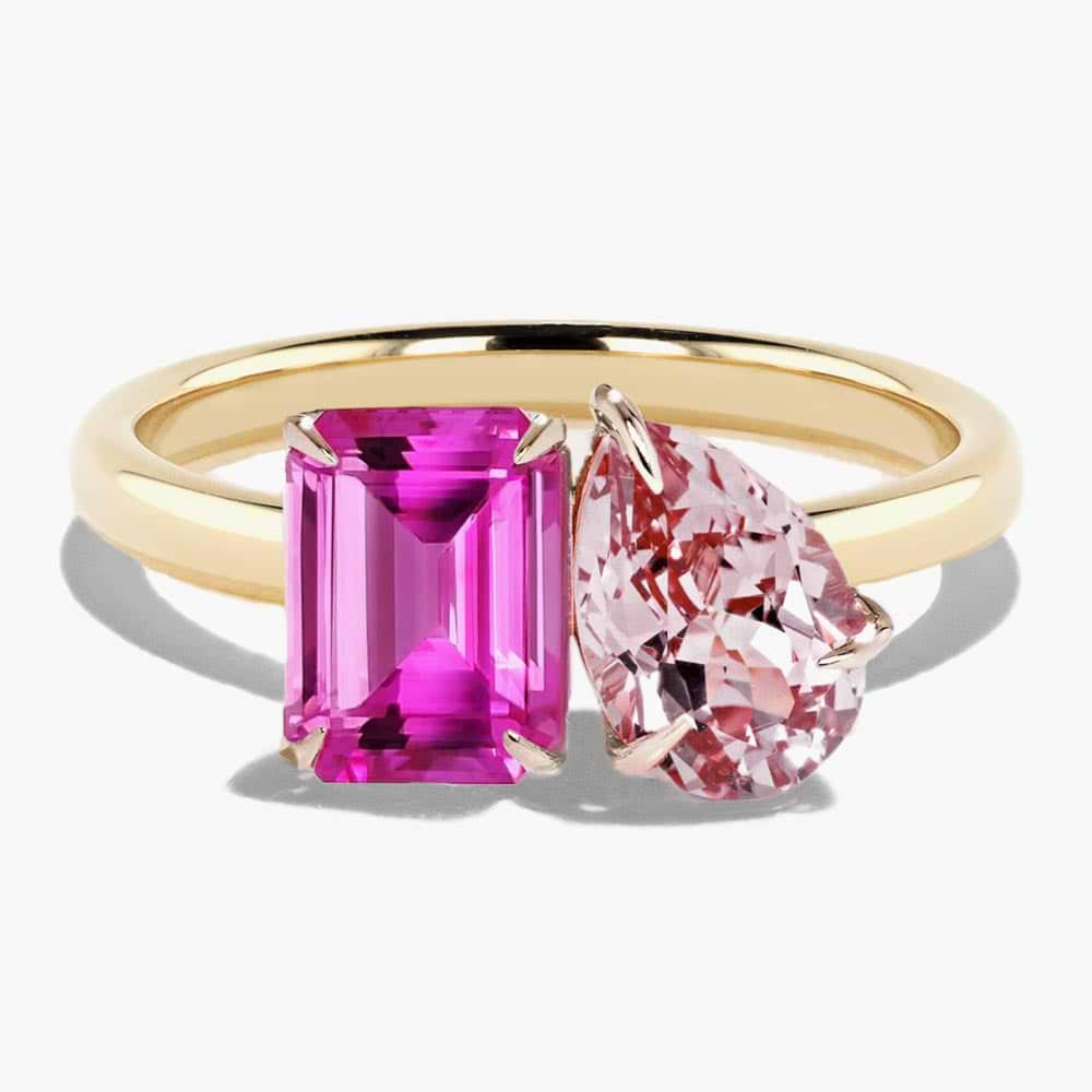 Shown in 14K Yellow Gold with an Emerald Cut Lab Created Pink Sapphire and a Pear Cut Lab Created Pink Champagne Sapphire
