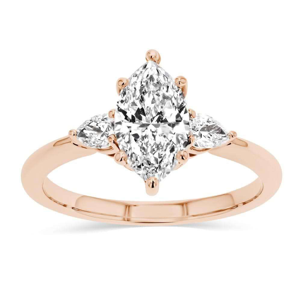 Shown In 14K Rose Gold With A Marquise Cut Center Stone|three stone ring with accenting pear cut stone and a marquise cut lab grown diamond center stone