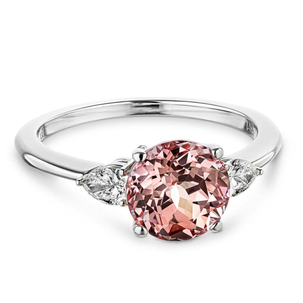 Shown with 2ct Lab Grown Champagne Pink Sapphire in 14k White Gold|Beautiful lab grown champagne pink sapphire engagement ring with pear cut side stones in 14k white gold