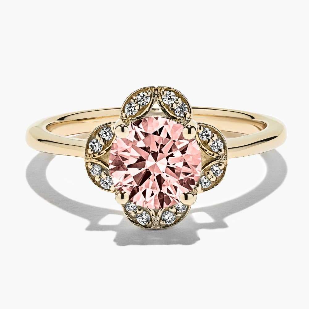 Shown here in 14K Yellow Gold with a Round Cut Pink Champagne Sapphire