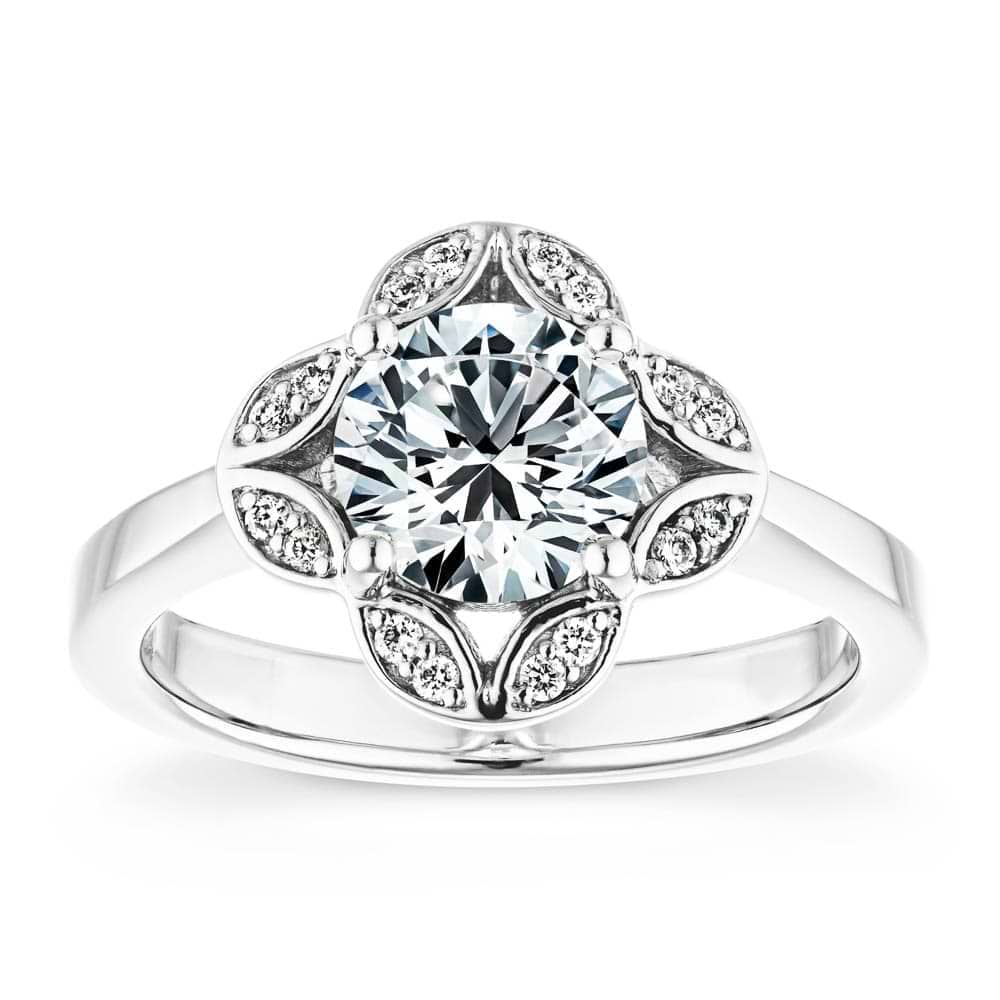 Shown with 1ct round cut lab grown diamond in 14k white gold|Nature inspired vintage style engagement ring with floral petal halo design around a 1ct round cut lab diamond in 14k white gold