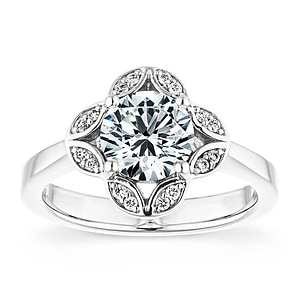 Nature inspired vintage style engagement ring with floral petal halo design around a 1ct round cut lab diamond in 14k white gold