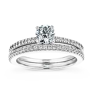  accented diamond wedding set Shown with a 1.0ct Round cut Lab-Grown Diamond with a diamond accented band in recycled 14K white gold with matching wedding band