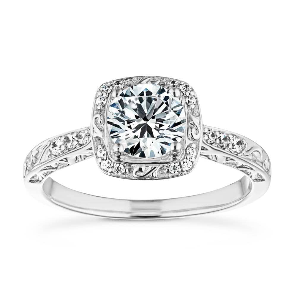 Shown with 1ct Round Cut Lab Grown Diamond in 14k White Gold|Antique style engagement ring with diamond accents and filigree detailing on the halo and band featuring 1ct round cut lab grown diamond in 14k white gold