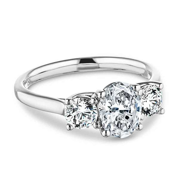 Shown with 1ct Oval Cut and Two 0.5ct Round Cut Lab Grown Diamonds in 14k White Gold|Romantic three stone engagement ring with 1ct oval cut lab grown diamond and two 0.5ct round cut lab diamond side stones in 14k white gold