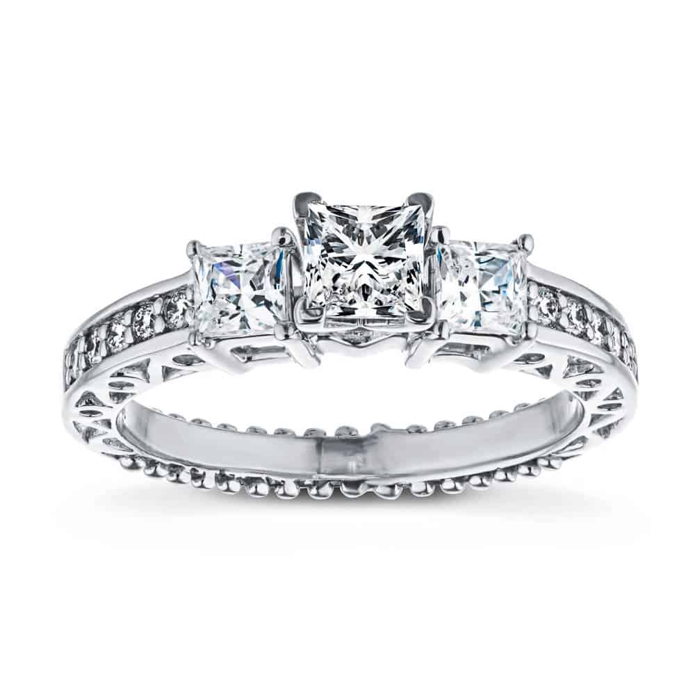 Shown with Three Princess Cut Lab Grown Diamonds Set in 14k White Gold|Vintage style three stone engagement ring with princess cut lab grown diamonds and antique style scroll detailing in 14k white gold