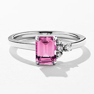 solitaire asymmetrical engagement ring with a lab grown gemstone pink sapphire emerald cut with accenting lab grown diamonds by MiaDonna