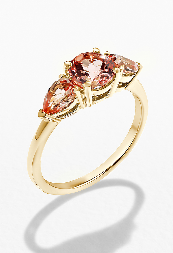 Emery Three Stone Engagement Ring set with Pink Champagne Sapphire Gemstones.
