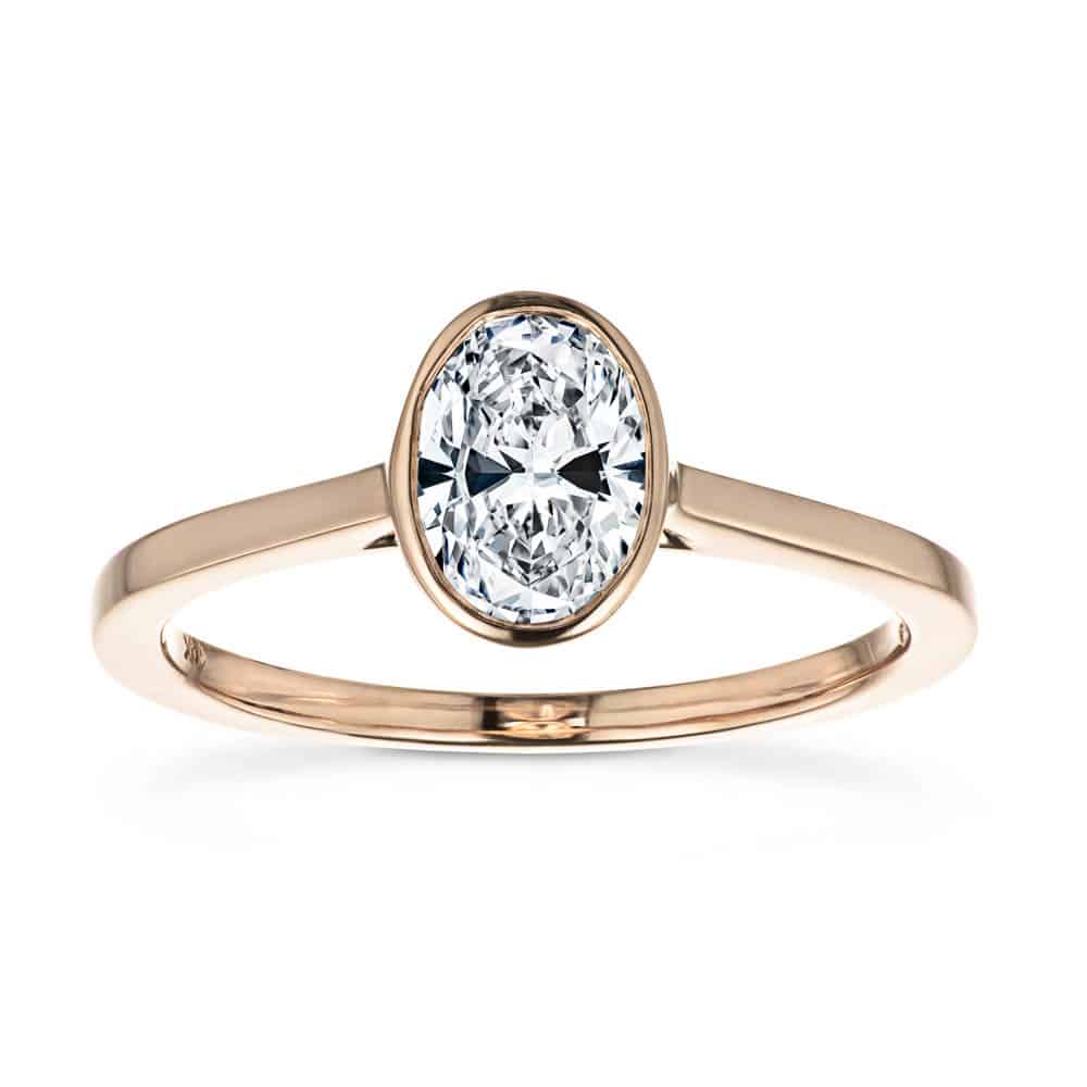 Shown In 14K Rose Gold With An Oval Cut Center Stone|bezel solitaire ring with an oval cut lab grown diamond center stone