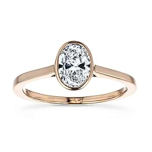 bezel solitaire ring with an oval cut lab grown diamond center stone