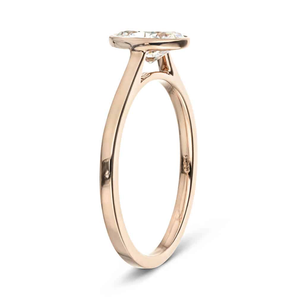 Shown In 14K Rose Gold With An Oval Cut Center Stone|bezel solitaire ring with an oval cut lab grown diamond center stone