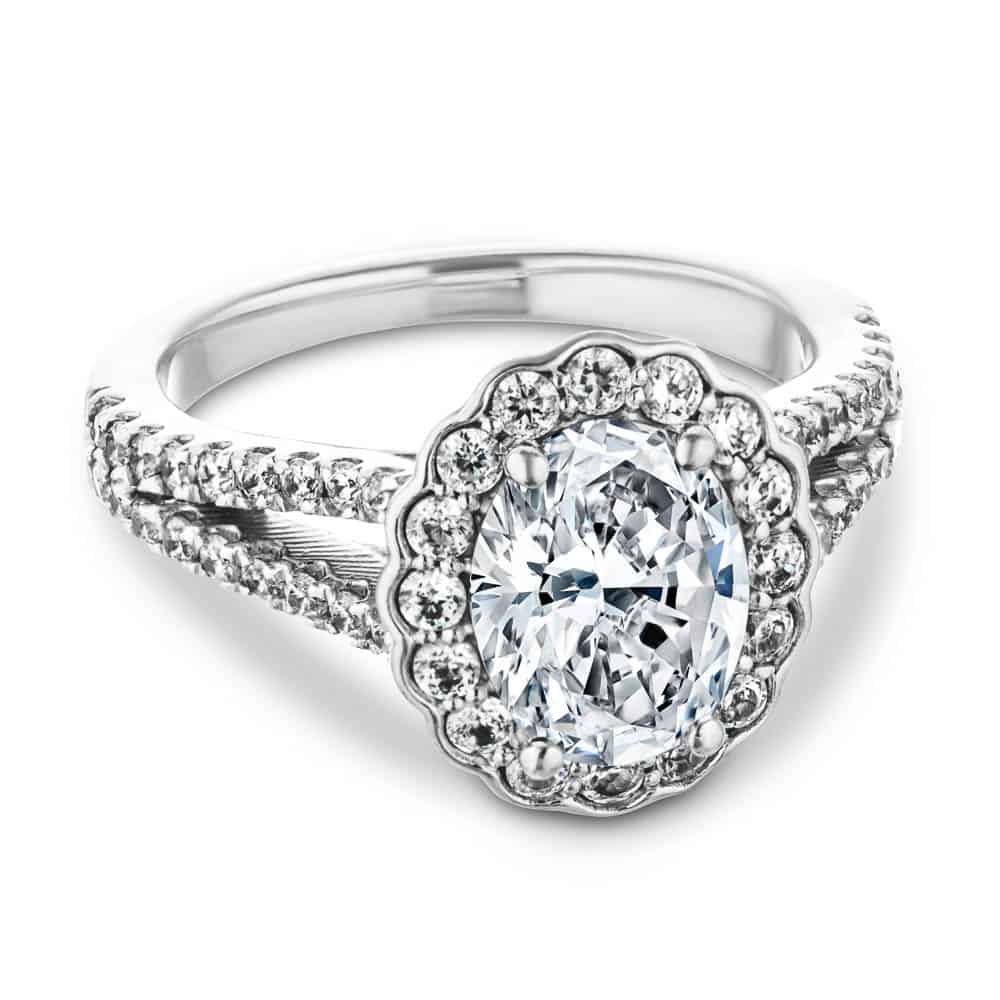 Shown with 1ct Oval Cut Lab Grown Diamond in 14k White Gold|Unique nature inspired flower halo engagement ring with diamond accented split shank holding a 1ct oval cut lab grown diamond in 14k white gold