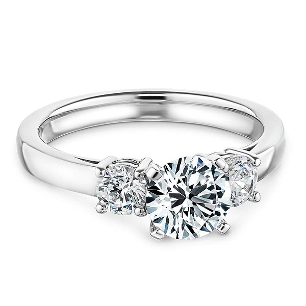 Shown with one 1ct and two 0.5ct Round Cut Lab Grown Diamonds in 14k White Gold|Elegant three stone ring with 1ct round cut lab grown diamond and two diamond shoulder stones in 14k white gold