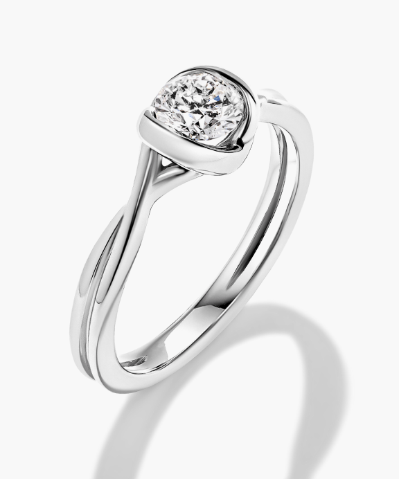 Modern lab grown diamond engagement ring.