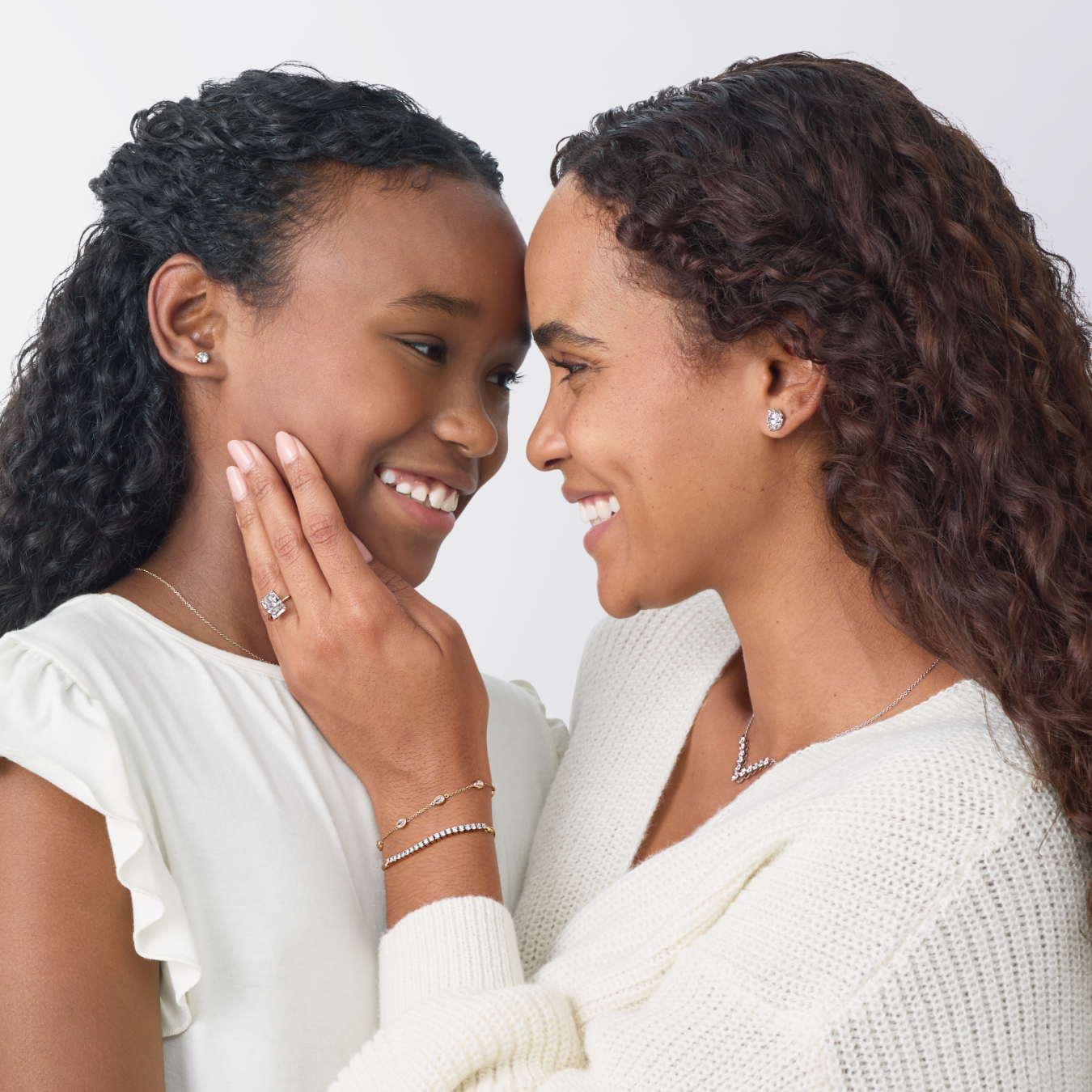Mother and daughter together wearing lab grown diamond jewelry from MiaDonna