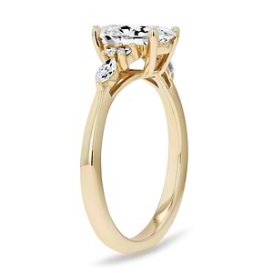 Diamond accented engagement ring with a 1ct oval cut lab grown diamond set in 14k yellow gold
