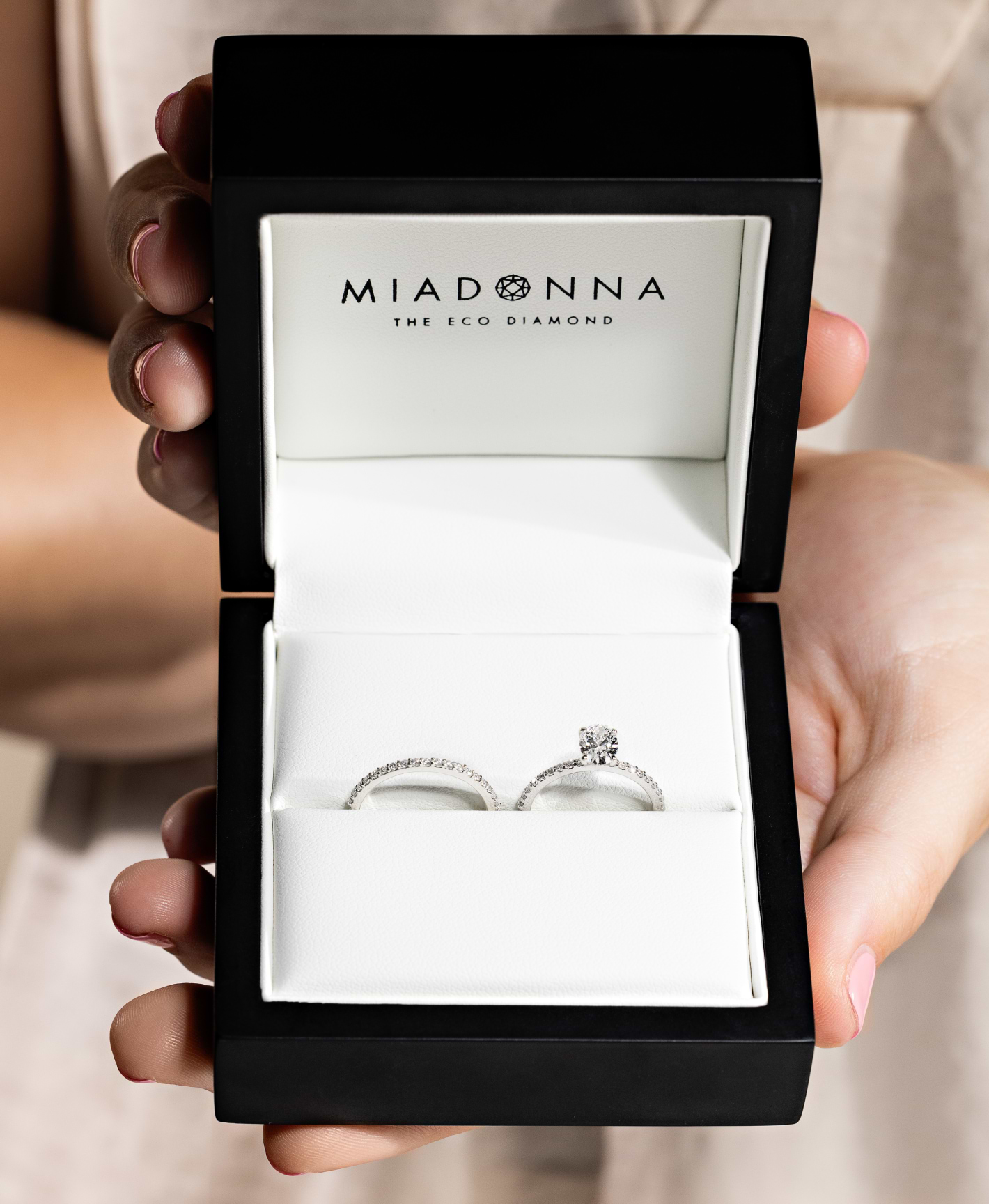 Picture of female hand wearing a MiaDonna  ethical solitaire engagement ring.