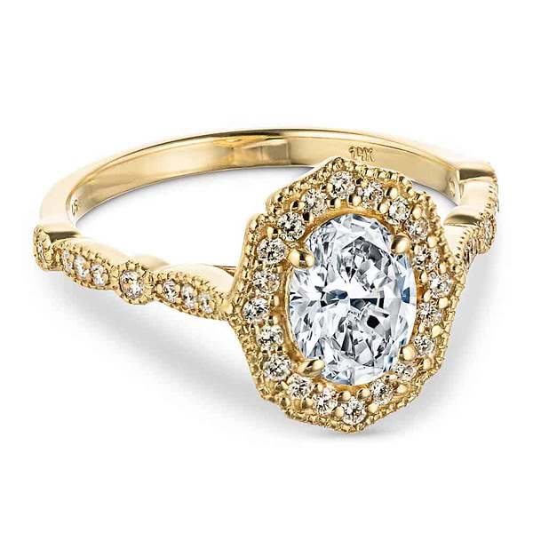 Shown with 1ct Oval Cut Lab Grown Diamond in 14k Yellow Gold|Romantic vintage style diamond accented halo engagement ring with a 1ct oval cut lab grown diamond set in filigree and milgrain detailed 14k yellow gold band