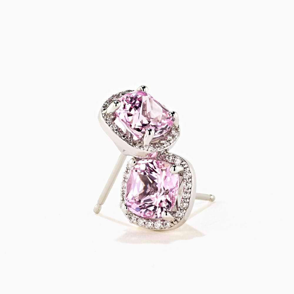 Shown in 14K White Gold|lab grown diamond halo stud earrings with pink champagne sapphire gemstones set in 14k white gold recycled metal