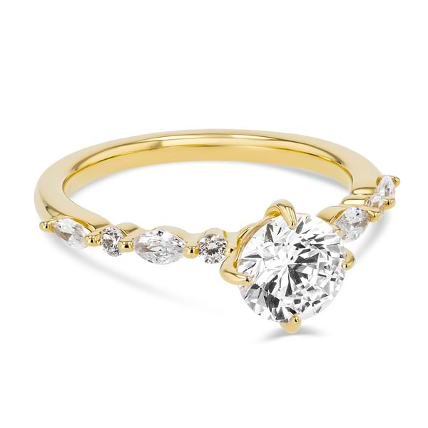 Shown here with a 1.0ct Round Cut center stone in 14K Yellow Gold|summer engagement ring with diamond accenting stones and a round cut center stone set in 14k yellow gold metal