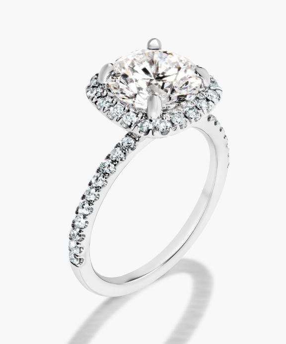 Vintage style white gold halo engagement ring with a sustainable lab grown diamond