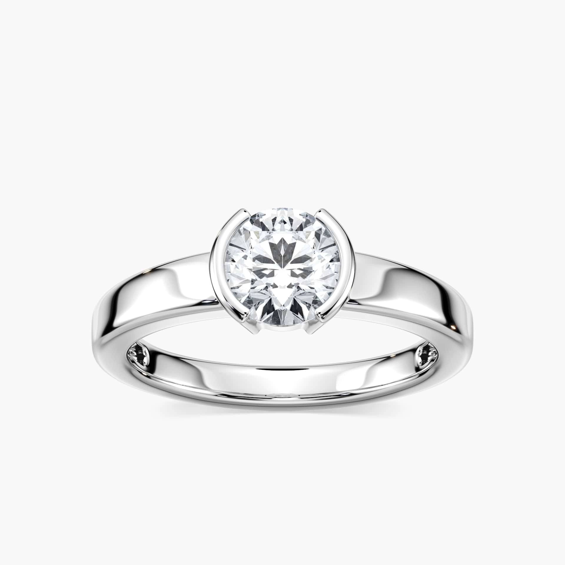 Shown with 1ct Round Cut Lab Grown Diamond in 14k White Gold|Minimalistic modern solitaire engagement ring with 1ct round cut lab grown diamond in 14k white gold worn on hand