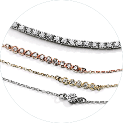 An image of a stack of various MiaDonna bracelets: A classic white gold tennis bracelet, a ten-stone bracelet with a delicate rose gold chain, a five-stone bracelet with a delicate yellow gold chain, and a bezel-set single lab-created diamond pendant bracelet with a white-gold chain.