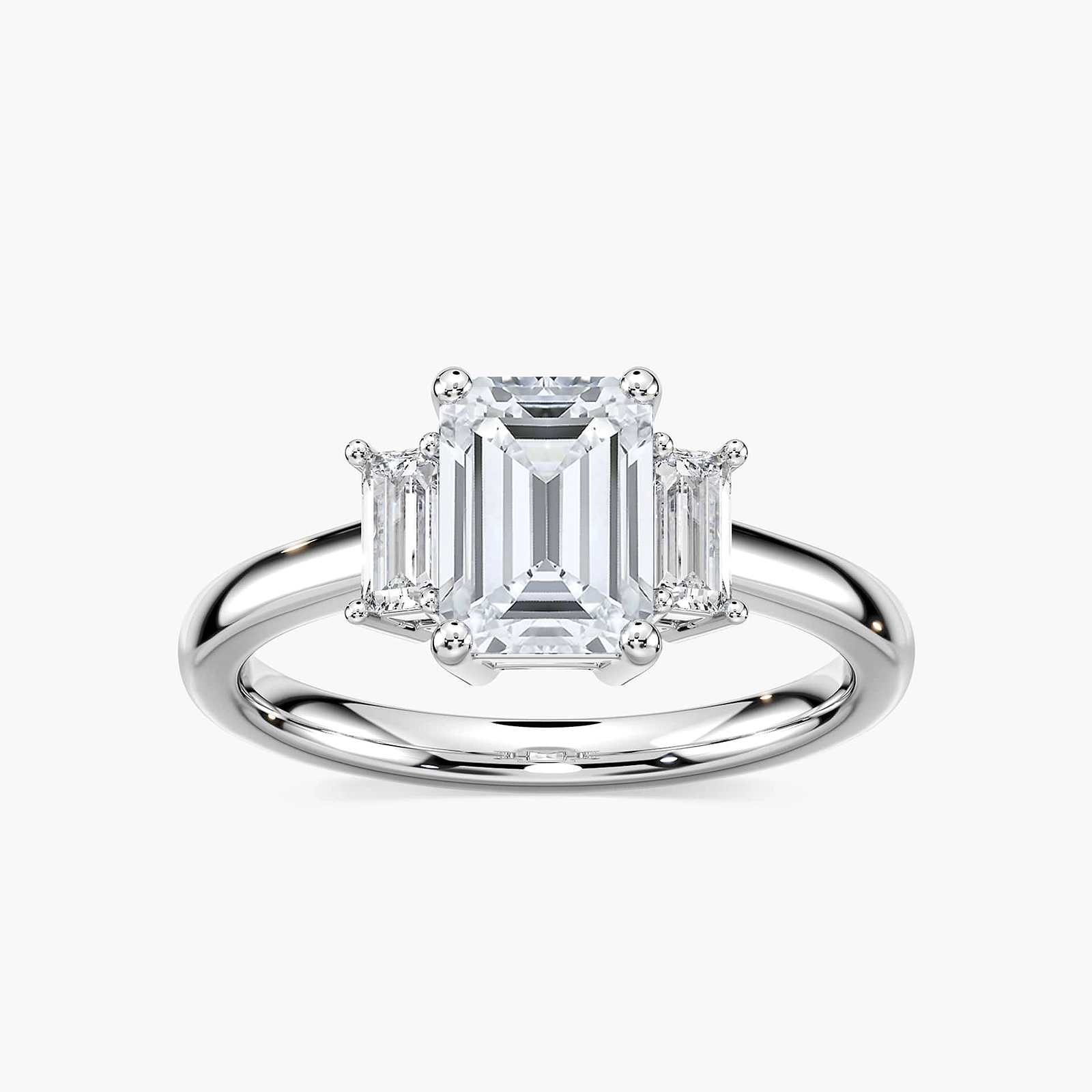 Shown with 1.75ct Emerald Cut Lab Grown Diamond in 14 White Gold|Ethical three stone engagement ring with 1.75ct emerald cut lab grown diamond center stone and two baguette cut diamond side stones in 14k white gold