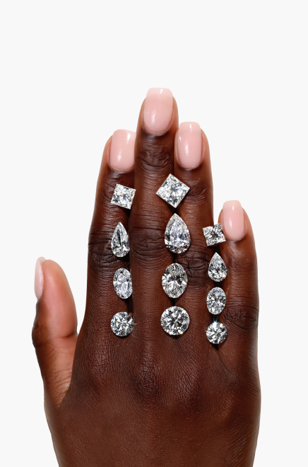 An assortment of lab grown diamond shapes on a hand