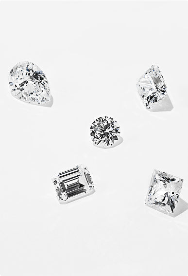 Loose MiaDonna lab-grown diamonds in a variety of cuts