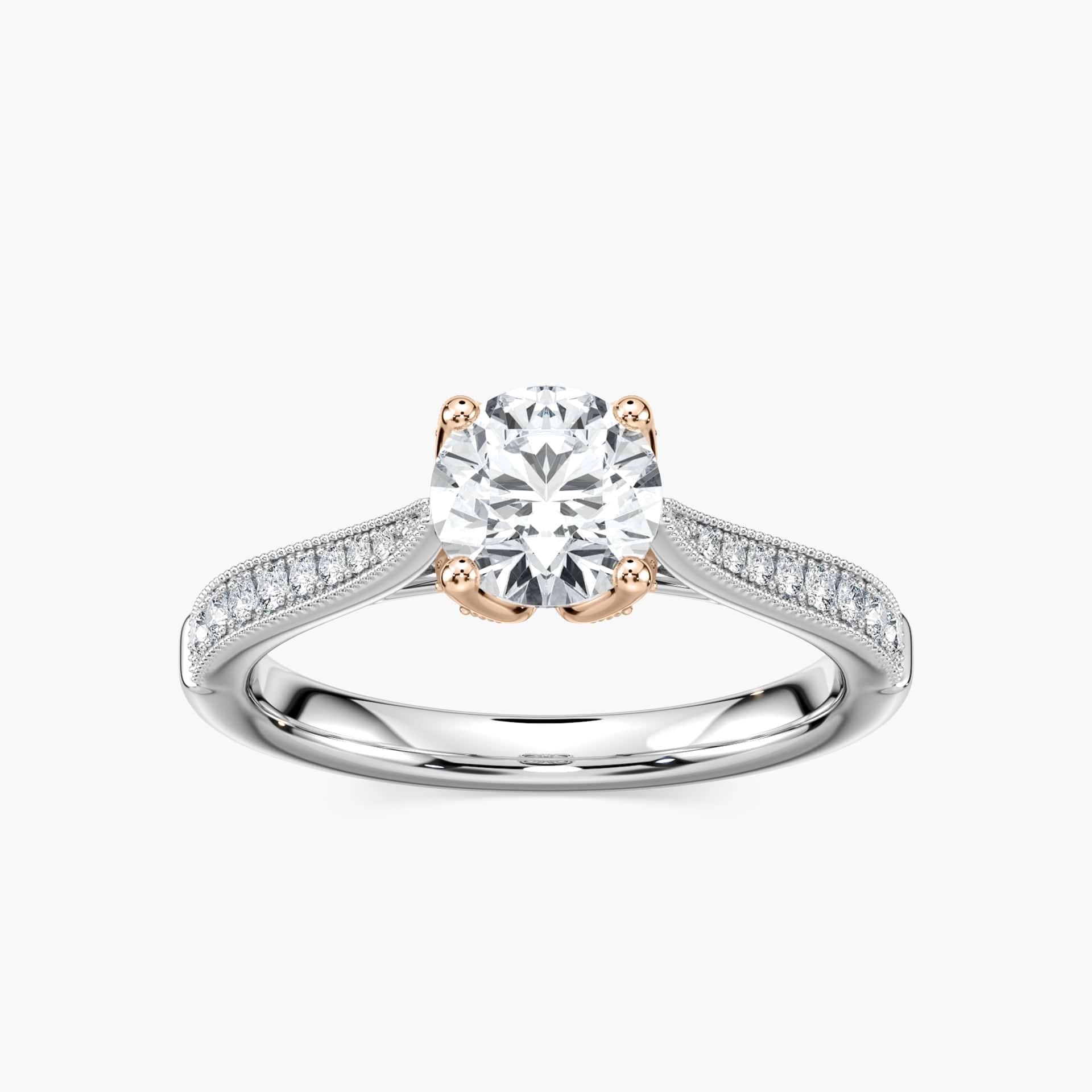 Shown with 1ct Round Cut Lab Grown Diamond in 14k White Gold|Vintage style nature inspired diamond accented engagement ring with a floral head holding a 1ct round cut lab grown diamond in 14k white gold band shown worn on hand