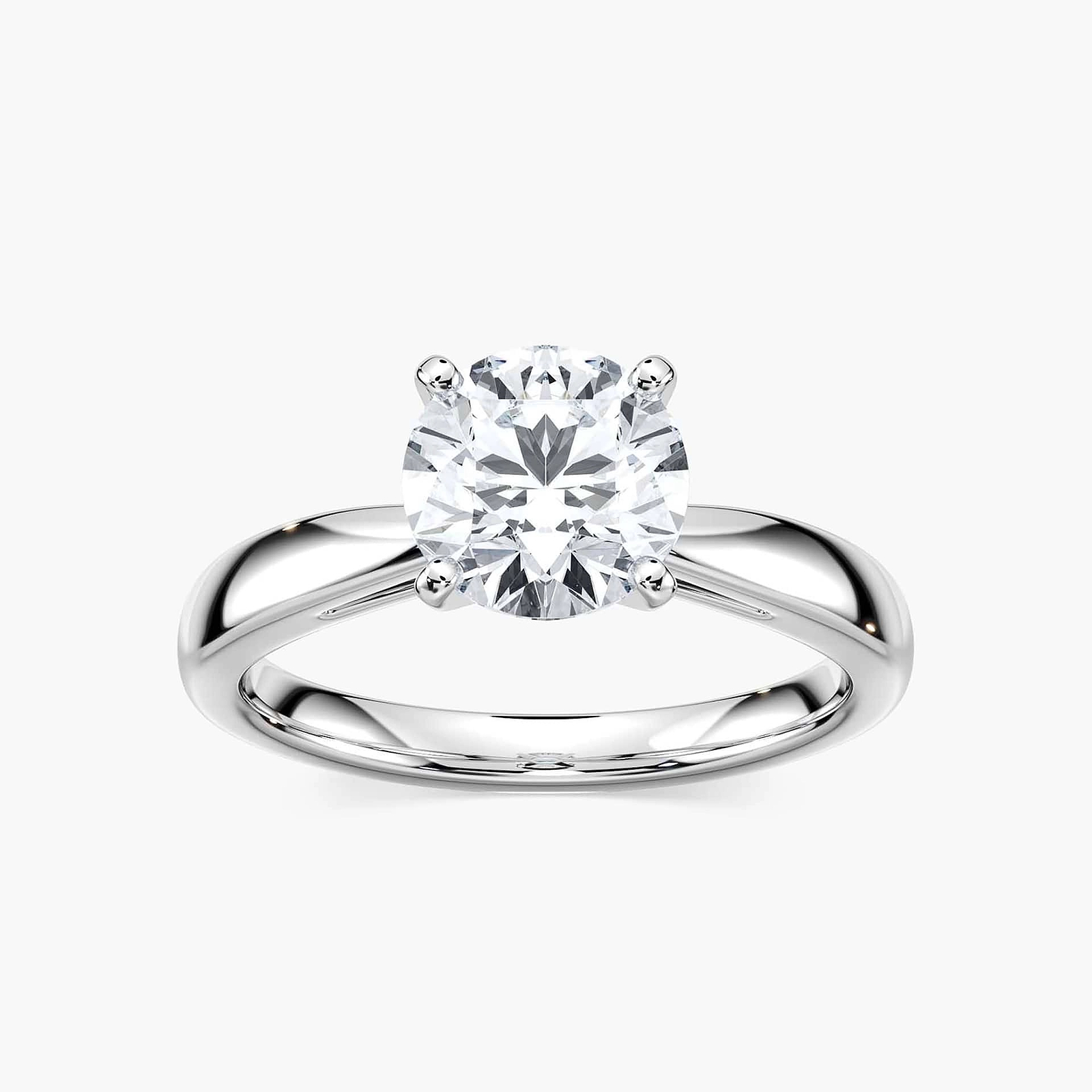 Shown with a 1ct Round Cut Lab Grown Diamond in 14k White Gold|Classic solitaire engagement ring with 1ct round cut lab grown diamond in cathedral style 14k white gold band shown worn on hand